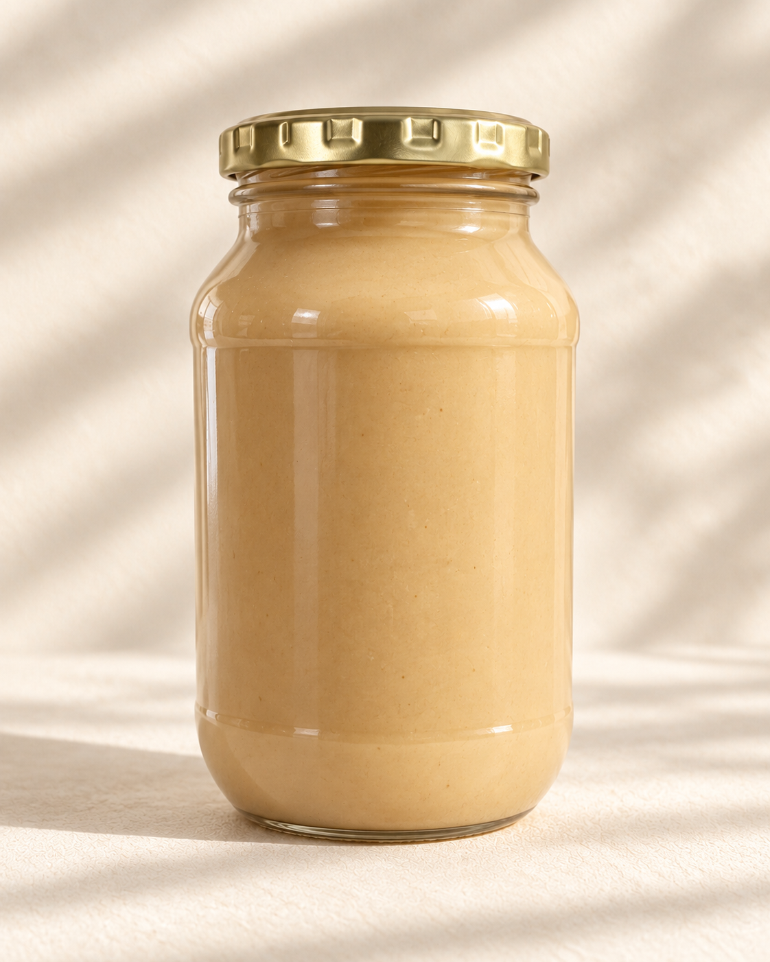 The Good Fat Pantry macadamia nut butter in a 1kg glass bottle