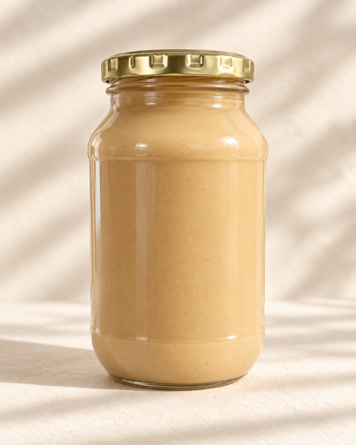 The Good Fat Pantry macadamia nut butter in a 1kg glass bottle